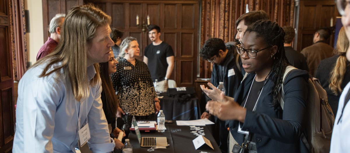 A job candidate talks to Corning at the Quantum Recruiting Forum