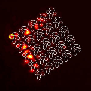 square with many circles making up the square representing a quantum topological insulator. The left edge of the square is lit up in red.