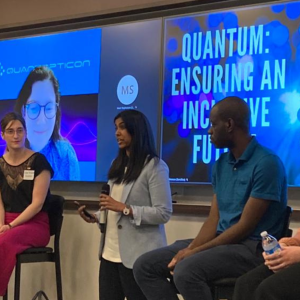 Panelists Thomas Searles, Bianca Giaccone, Victory Omole, Chloe Archambault, and Mirella Koleva (on screen) are introduced by moderator Meera Raja as the event Quantum: Ensuring an Inclusive Future begins. 