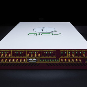 Front view of a QICK electronic device with connectors and indicators.