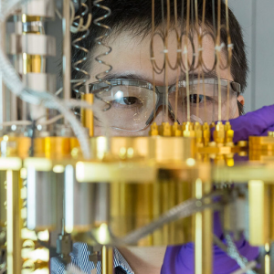 Man looking at dilution refrigerator