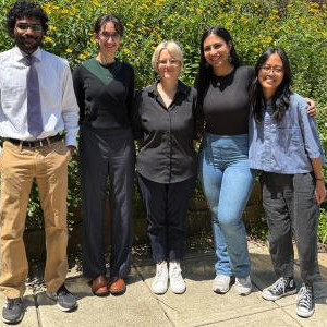 Undergraduate fellows stand together outside.
