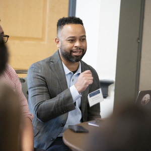 man speaks at Summit