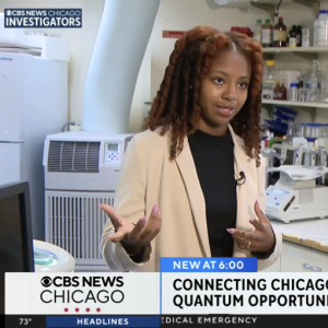 Television news screenshot of a woman speaking in a laboratory, with CBS News Chicago graphics and a quantum-computing headline.