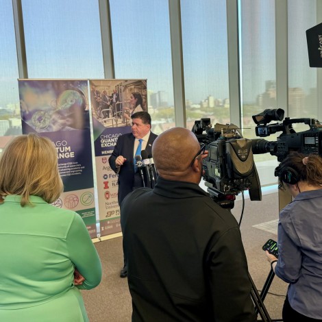 Pritzker meeting with the media at a CQE event